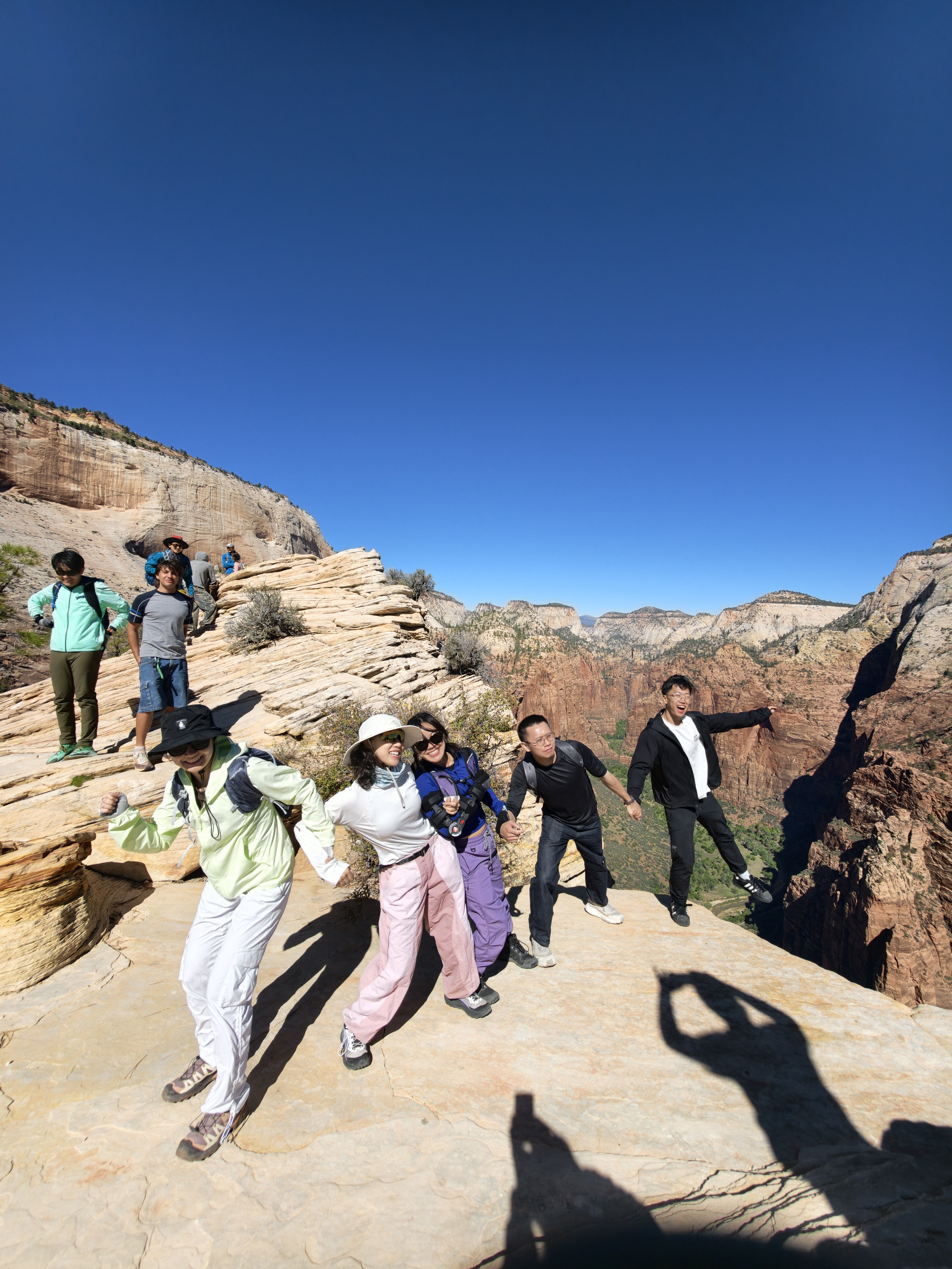 A playful group photograph with friends on the trail